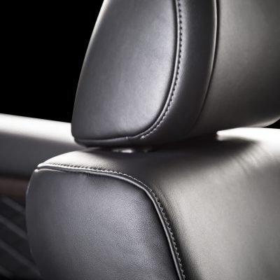 Modern luxury car  black leather interior. Part of  leather car seat details.